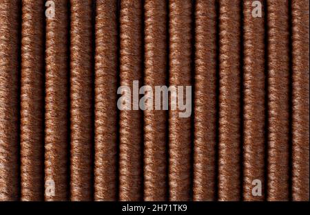 Wafer rolls background. Chocolate wafer roll sticks lies in line and fill the whole frame of picture. Crispy dessert background concept. Close up Stock Photo