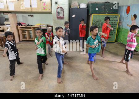 Classroom education, counselling support and first aid techniques provided to street kids. Kolkata, India. Stock Photo