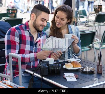 Tourist couple at open-air cafe. Stock Photo