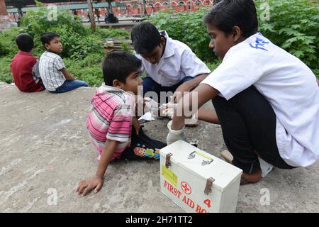 Classroom education, counselling support and first aid techniques provided to street kids. Kolkata, India. Stock Photo