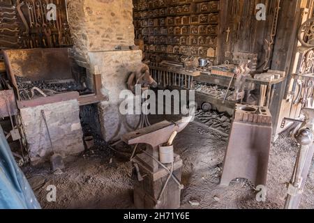 The blacksmith's anvil and forge in the blacksmith shop in the old ghost town of Shakespeare, New Mexico. Stock Photo