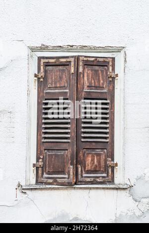 Old window with closed wooden shutters, Germany Stock Photo