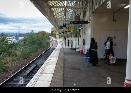 Northern Rail trains pass through the West Yorkshire railway station of Halifax, Calderdale, England, UK Stock Photo