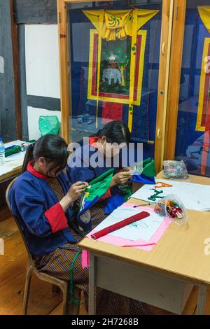 Sewing students in the National Institute of the Thirteen Arts learn embroidery in Thimphu, Bhutan.