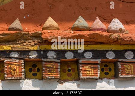 Tsatas on a shelf at the Dechen Phodrang Monastery in Thimphu, Bhutan. Stock Photo