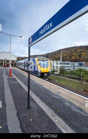 Northern Rail trains pass through the West Yorkshire railway station of Halifax, Calderdale, England, UK Stock Photo