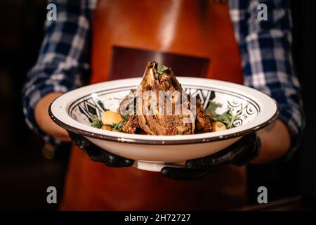 Cooked Lamb Ribs Seasoned with Parsley. Stock Photo