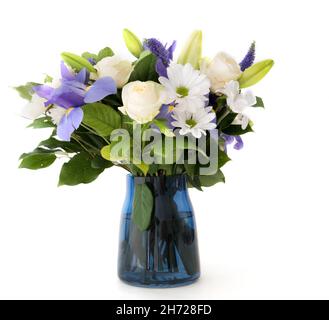 Funeral Bouquet purple White flowers, Sympathy and Condolence Concept on white background with copy space. Stock Photo