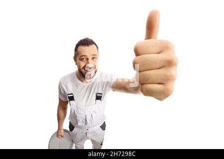 House painter smiling and showing thumbs up in front of camera isolated on white background Stock Photo