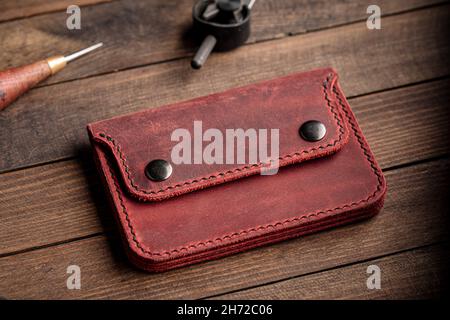 Top view on hand crafted red leather wallet Stock Photo