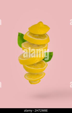 Isolated flying lemons. Falling sliced lemon fruit isolated on white ...
