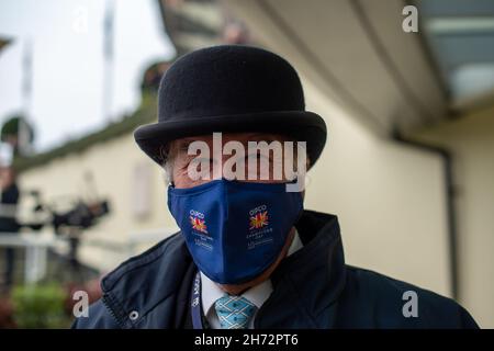 Ascot, Berkshire, UK. 19th November, 2021. An Ascot Steward wears a face mask. Although the wearing of face masks is no longer mandatory whilst indoors, Ascot Racecourse continue to have measures in place for to help protect jockeys and stewards from Covid-19 transmission. Jockeys in the Weighing Room must still wear face masks and Ascot stewards also continue to wear face masks. Credit: Maureen McLean/Alamy Live News Stock Photo