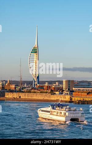 isle of wight ferry passing the spinnaker tower at the entrance to portsmouth harbour, isle of wight passenger ferry passing gunwharf quays portsmouth