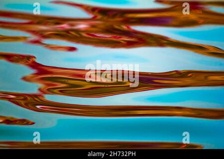colorfull reflection in water. River Ganges, India Stock Photo