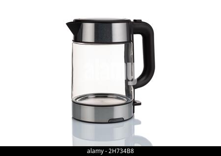 Glass, electric, modern transparent kettle on a white background. Close-up. Stock Photo