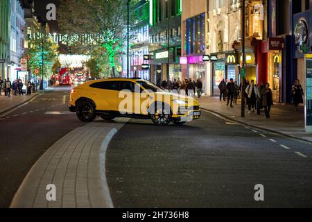 Pic shows: Diplomatic plated Porsche Panamera, crossed the central reservation in Oxford St to do a U turn.   Central London Xmas 2021       picture b Stock Photo