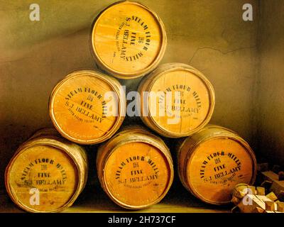 Six wooden flour barrels stamped Steam Flour Mills, stacked in a pyramid shape, at J. Bellamy Flour Mill, Upper Canada Village, Ontario, Canada. Stock Photo