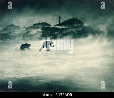 A photo from the Shackleton Endurance expedition showing men battling a 100mph (160km/h) wind in Antarctica Stock Photo