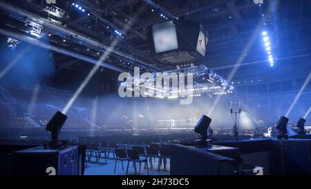 Strobe lights emitting different color beams hanging under the ceiling. Spotlight filler lights mounted on the ceiling. Stock Photo