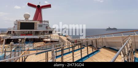 Saint Vincent and the Grenadines - May 8, 2020: Panoramic shot of open decks and red funnel on Carnival Freedom. Carnival Valor, Carnival Fascination, Stock Photo