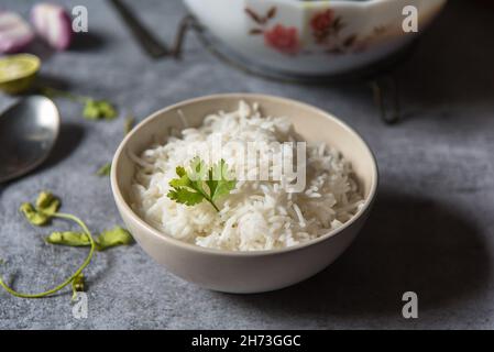 Coriander leaf on cooked basmati rice with use of selective focus Stock Photo