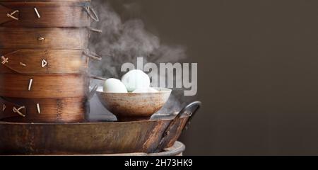 Chinese tea eggs and streamed dumpling in morning at retail outlet street food. Stock Photo