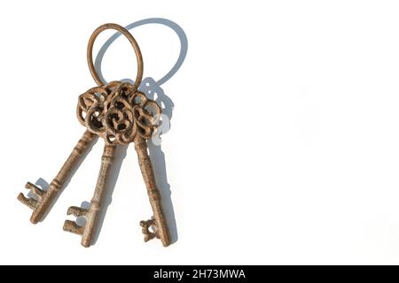 Antique keys on a white color background Stock Photo