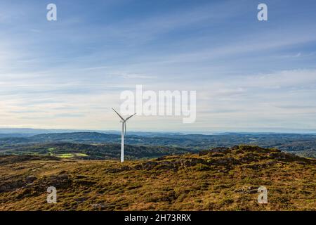 Isolated Wind Generator on top of mountain with copy space. Stock Photo