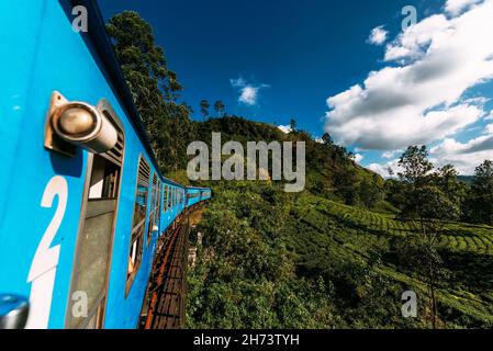 Train from Nuwara Eliya to Kandy among tea plantations in the highlands of Sri Lanka. Train on the Nine Arch Bridge in Sri Lanka. Travel by train. Tra Stock Photo