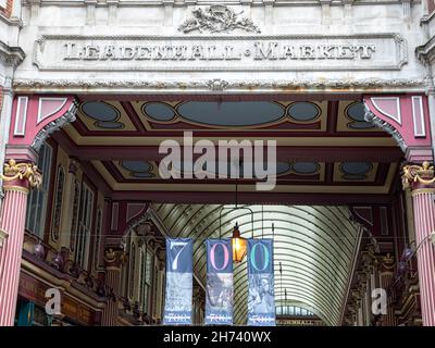 LONDON, UK - JULY 23, 2021:  Carved stone sign above entrance to Leadenhall Market in the City of London