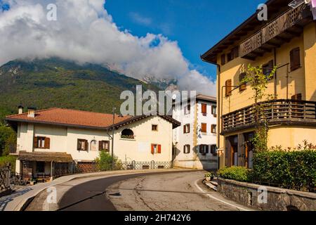 The main road which runs through the small town of Ampezzo in Udine Province, Friuli-Venezia Giulia, north east Italy Stock Photo