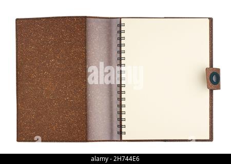 top view closeup of open notebook with metal spirals and brown cork hardcover blank pages isolated on white Stock Photo