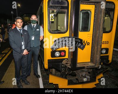 Saturday, 20 November, 2021 - The first GWR Dartmoor Line train arrives at Okehampton Station.  A regular passenger service to Exeter has been inaugurated after a gap of nearly 50 years.  To renew the way, 11 miles of new track were laid, with 24,000 concrete sleepers, and 29,000 tonnes of balast.  Restoring regular service will improve links for commuters and provide a terminal for visitors to explore Dartmoor National Park.  It will boost boost local businesses, the tourism sector and provide better access to work and education for locals. Stock Photo