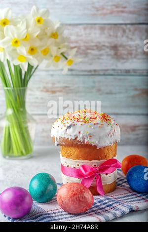 Fragrant homemade Easter cake with eggs and the first spring flowers Stock Photo