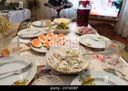 large New Year's table with many beautiful and delicious dishes Stock Photo
