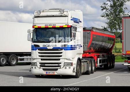 White Scania R560 tipper truck parked on a truck stop on a day of summer. Salo, Finland. July 31, 2020. Stock Photo