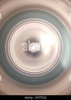 Looking into the Tub of a Washing Machine on Spin Cycle Stock Photo