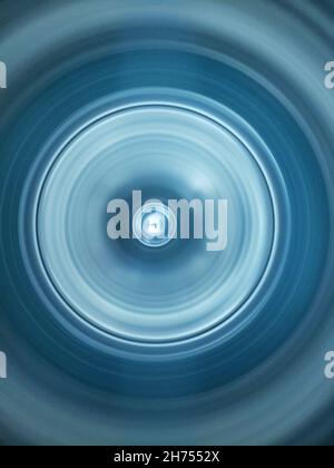 Looking into the Tub of a Washing Machine on Spin Cycle Stock Photo