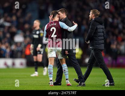 Aston Villa manager Steven Gerrard with Matty Cash as Brighton and Hove Albion manager Graham Potter (right) looks on following the Premier League match at Villa Park, Birmingham. Picture date: Saturday November 20, 2021. Stock Photo