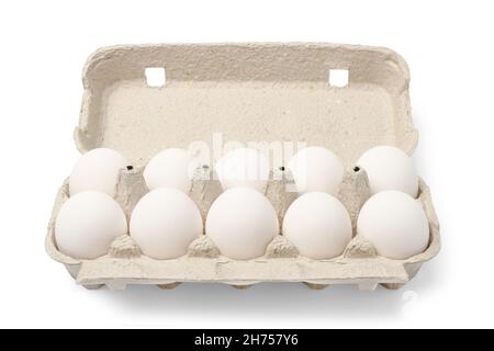 Ten chicken eggs in cardboard cassette isolated on white Stock Photo