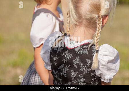 NAZ-SCIAVES, ITALY - OCTOBER 13, 2019: Young children in typical costume during an autumn local celebration in Val Isarco ( South Tirol ) Stock Photo