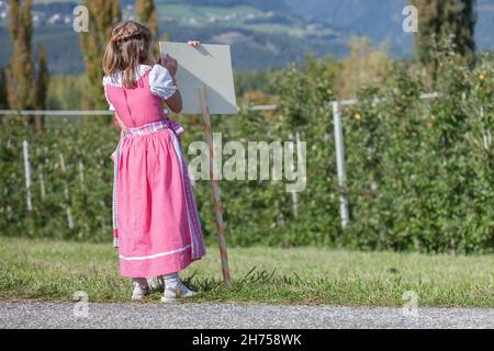 NAZ-SCIAVES, ITALY - OCTOBER 13, 2019: Young child in typical costume during an autumn local celebration in Val Isarco ( South Tirol ) Stock Photo