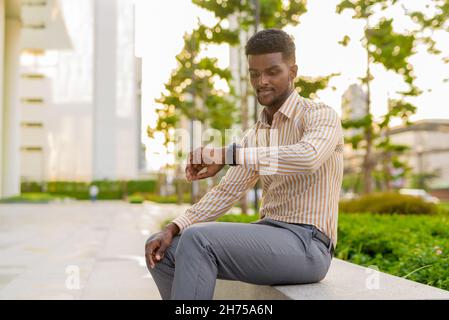 Portrait of young handsome African businessman wearing stylish clothes Stock Photo