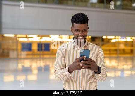 Portrait of young handsome African businessman wearing stylish clothes Stock Photo