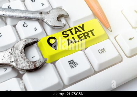 Handwriting text Stay Alert. Word Written on Paying full attention to things around Quick to see or understand Typing Firewall Program Codes Stock Photo