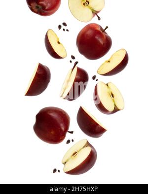 Falling red juicy apples and apples slices isolated on white background Stock Photo