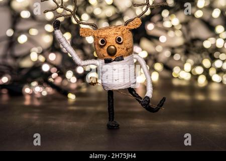 Christmas composition, dancing cork deer with Christmas lights, Christmas decoration scene with copy space Stock Photo
