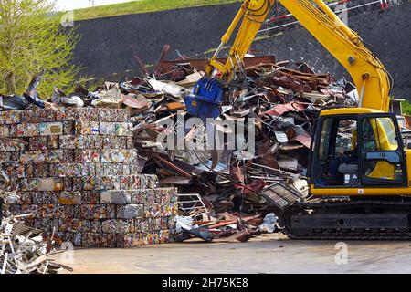 The technology of compressing scrap into briquettes for recycling at the open –air in Japan. Concept  of  recycling scrap.  Rational use of waste with Stock Photo
