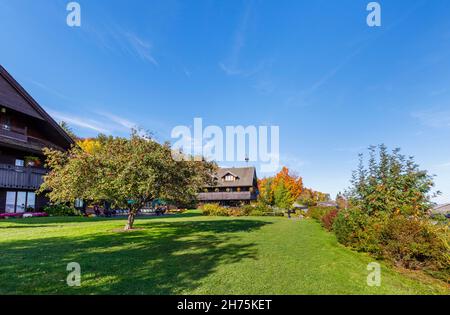 The iconic Von Trapp Family Lodge, a luxury hotel mountain resort with European Alpine chalet style architecture in Stowe, Vermont, New England, USA Stock Photo