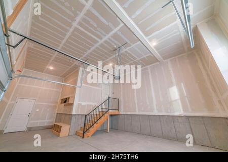 Empty garage interior with an automatic door operator Stock Photo